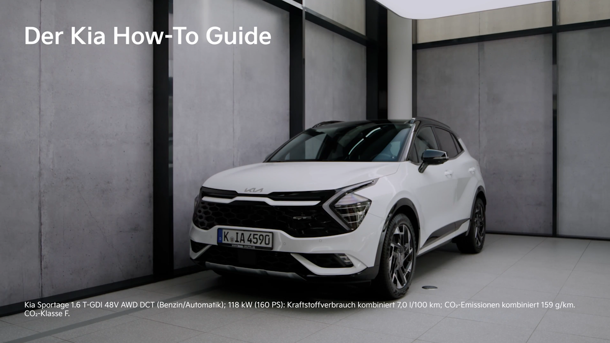 Weißer Kia Sportage, halbseitlich